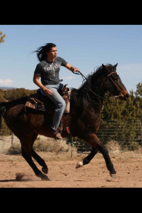 David Midthunder Riding A Horse