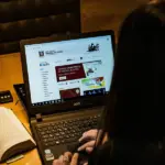 Lawyer reviewing bar status and legal credentials online for professional verification